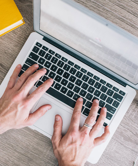 hands using a laptop