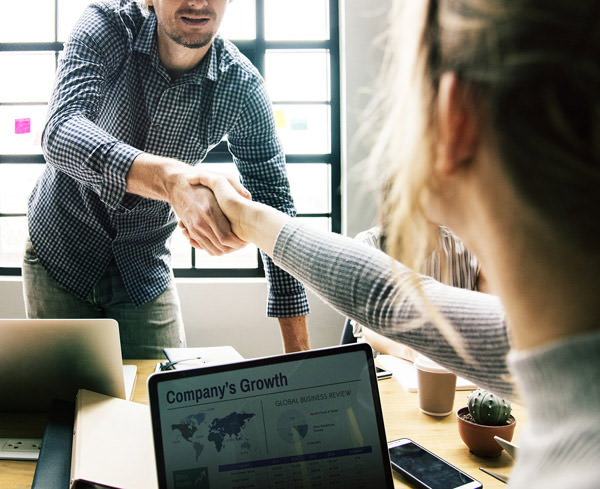 two people shaking hands